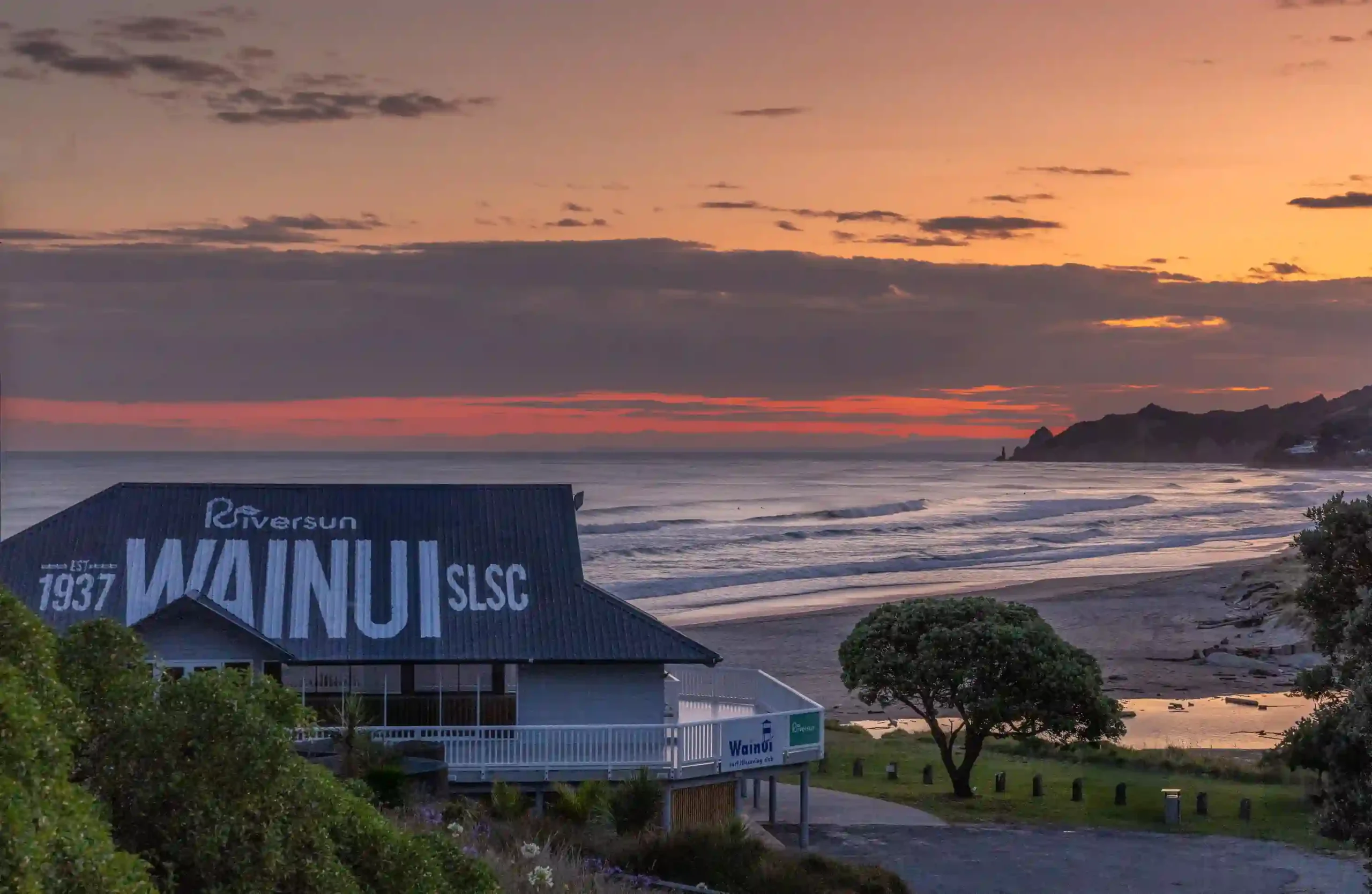 Wainui Surf Club beachfront wedding venue at sunset showing affordable Gisborne venue option