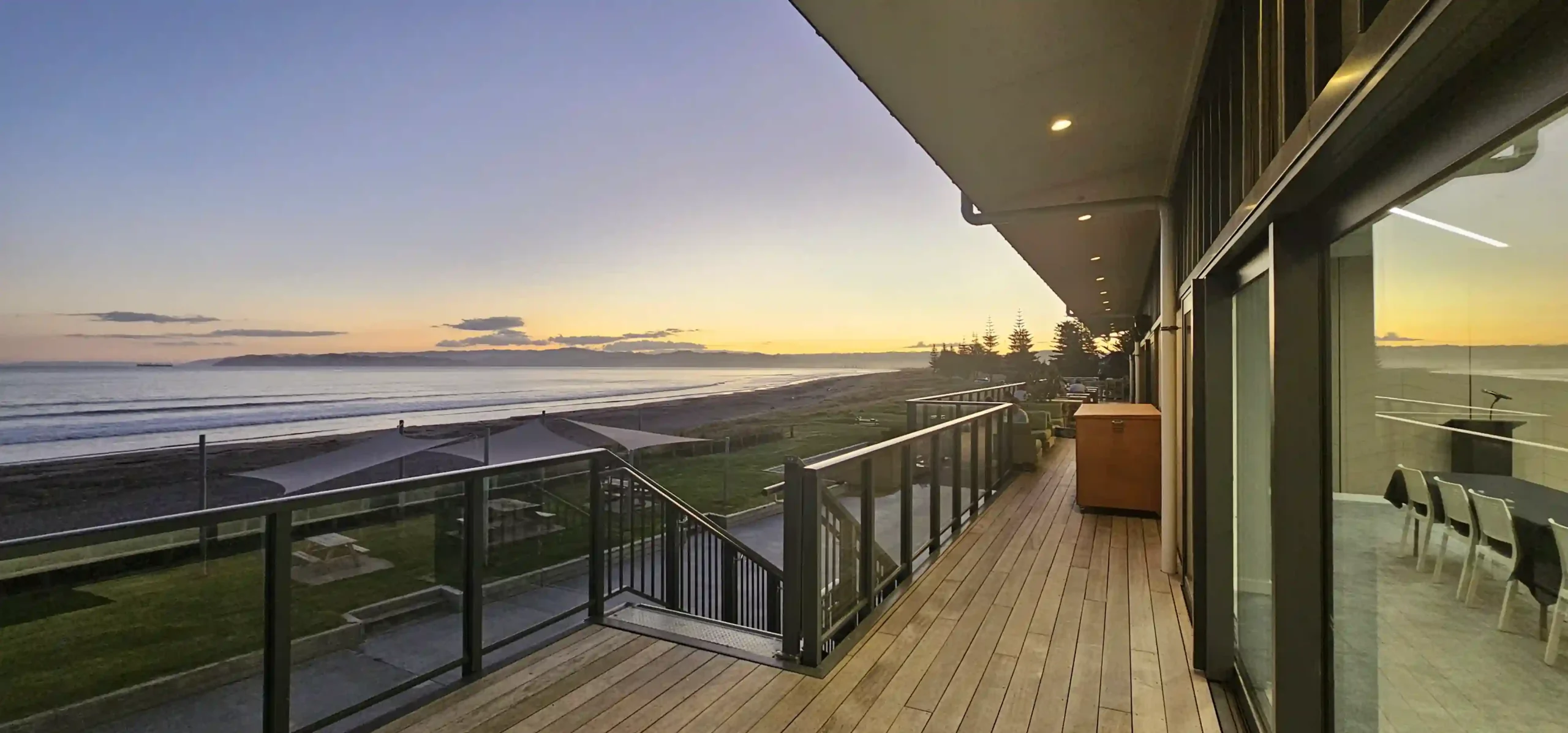 Panoramic ocean sunset view from Midway Hub deck overlooking Midway Beach Gisborne event venue