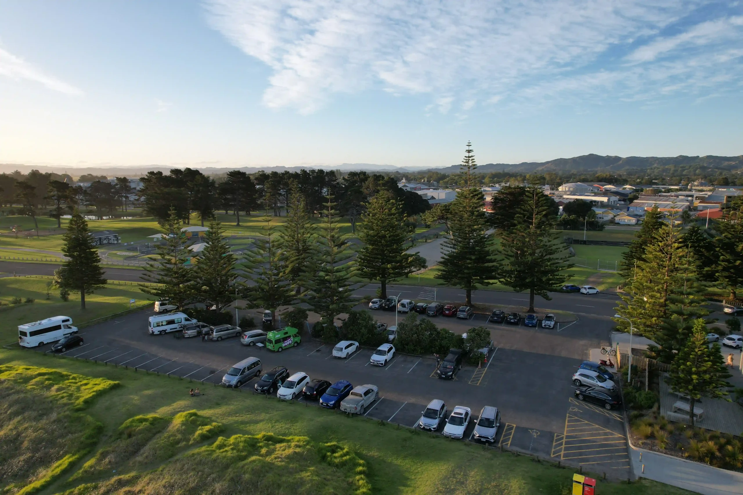 Free on-site parking at a Gisborne Christmas party venue surrounded by Norfolk pines